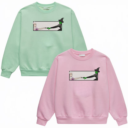 Wicked Glinda and Elphaba Hand Embroidery Sweatshirt – Colorful Defy Gravity Broomstick Magic Wand Design, Wizard of Oz Witch Sweatshirt, Pink and Green Tee, Perfect Gift