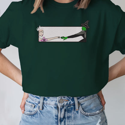 Wicked Glinda and Elphaba Hand Embroidery Sweatshirt – Colorful Defy Gravity Broomstick Magic Wand Design, Wizard of Oz Witch Sweatshirt, Pink and Green Tee, Perfect Gift