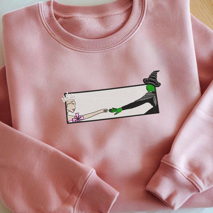 Wicked Glinda and Elphaba Hand Embroidery Sweatshirt – Colorful Defy Gravity Broomstick Magic Wand Design, Wizard of Oz Witch Sweatshirt, Pink and Green Tee, Perfect Gift